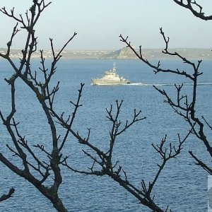 A naval ship that needs identifying out in the Bay