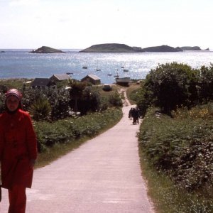 Jan climbing the steep hill from the quay, St Martin's, 1977