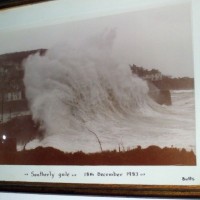 Wave hits Mousehole Quay in December, 1983