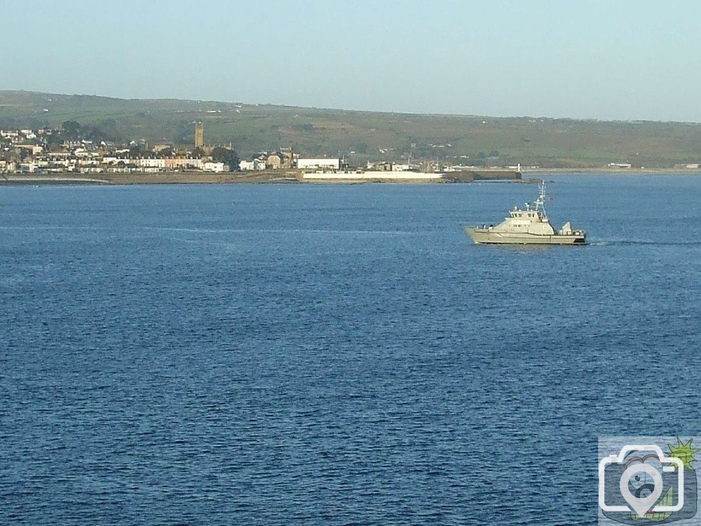 A naval ship (or fisheries vessel) bound for Newlyn Harbour
