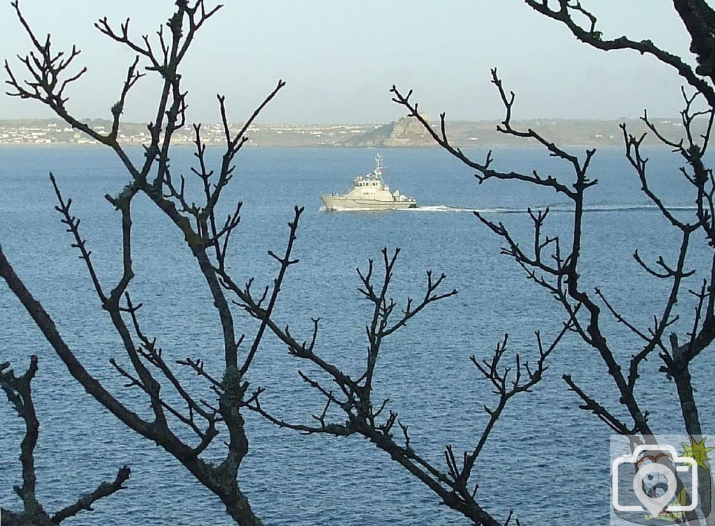 A naval ship that needs identifying out in the Bay