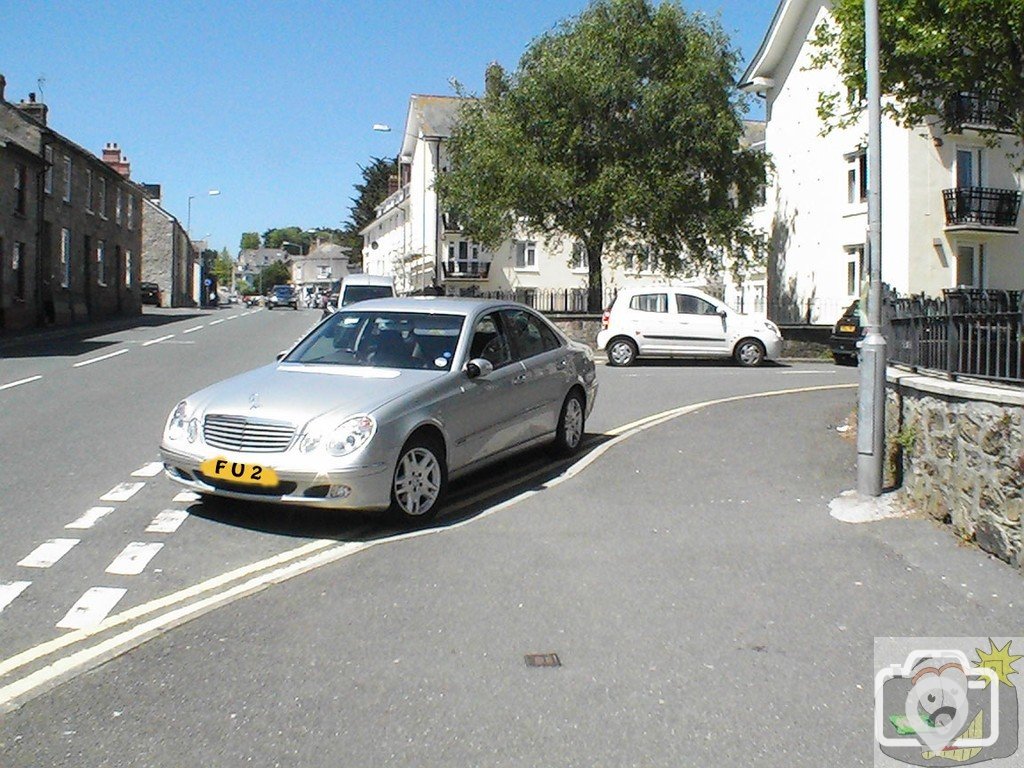 Fancy Car Blocks Disabled Access Ramp.