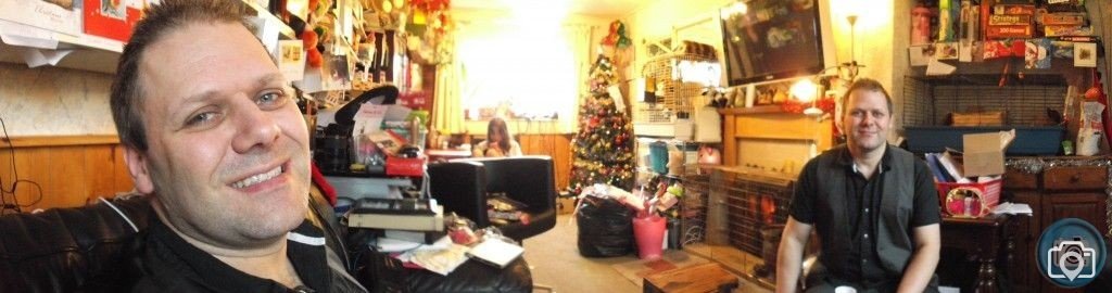 panorama photo of living room with mark and marks evil twin lol