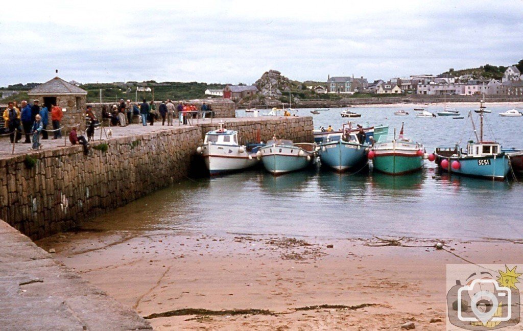 St Mary's harbour small pier with launches at rest, 1977