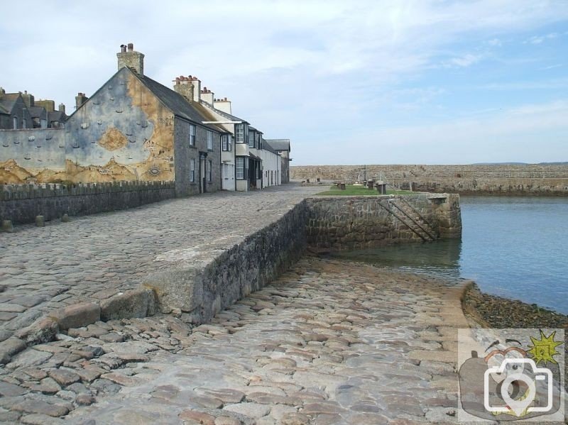 The wharf at harbourside and map mural - St Michael's Mount