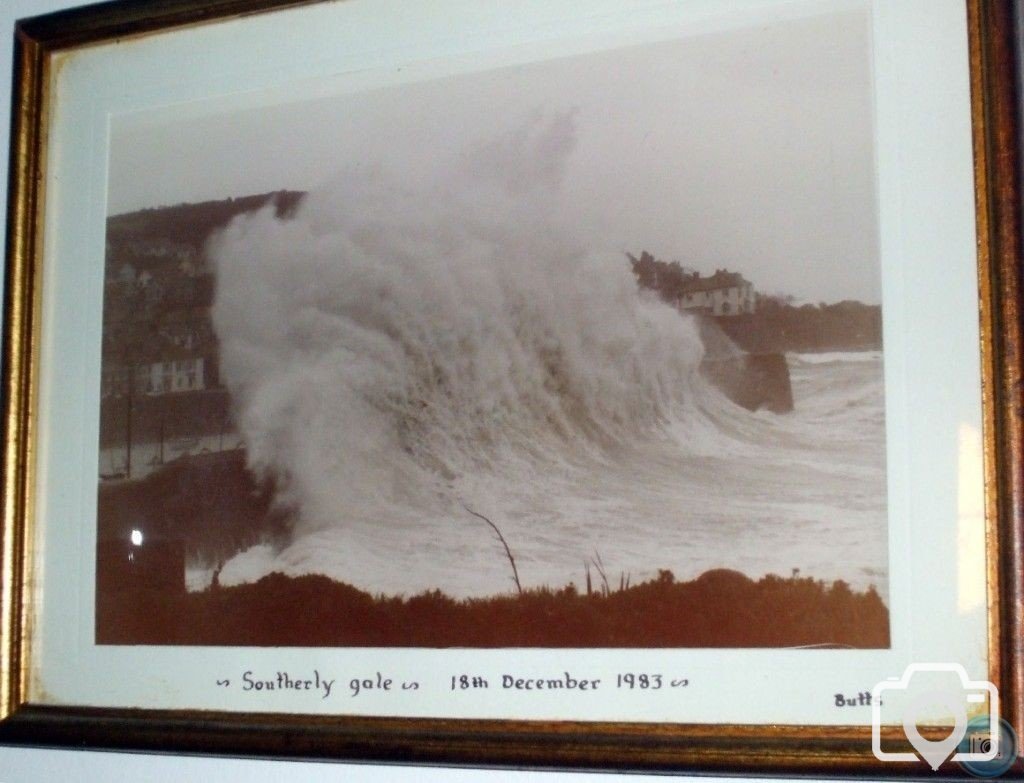 Wave hits Mousehole Quay in December, 1983