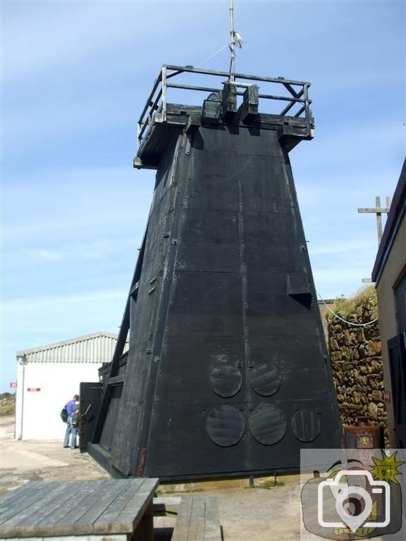 Weatherboarded headgear at Skip Shaft, Levant Mine