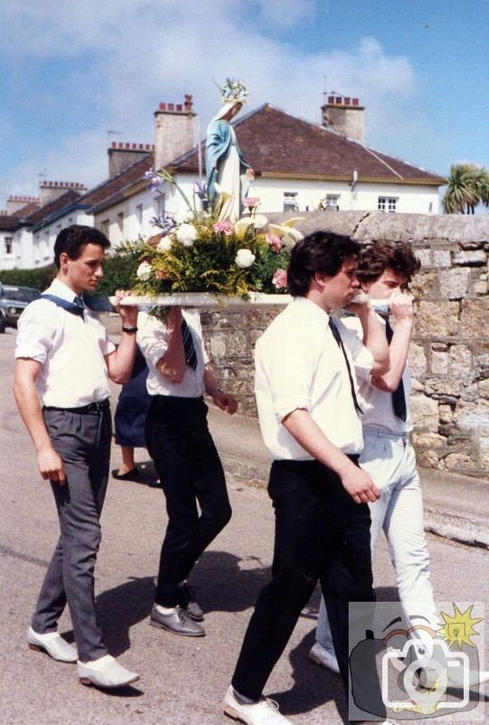 Young Male Parishioners carry Our Lady's Float