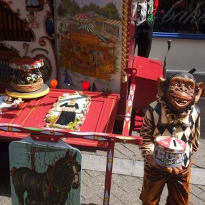 Monkey with collecting tin