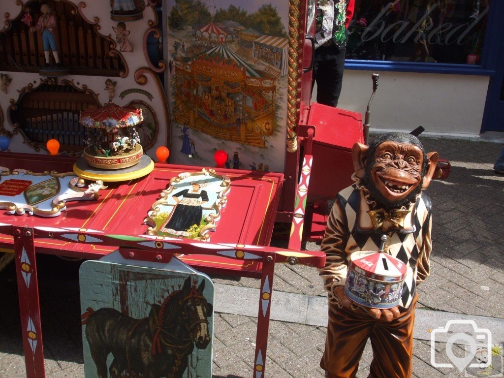 Monkey with collecting tin