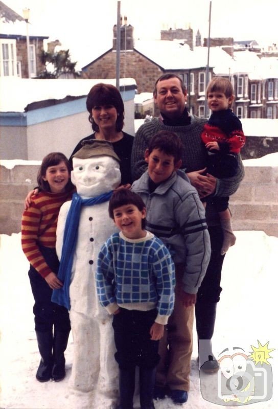 Our family and a snowman